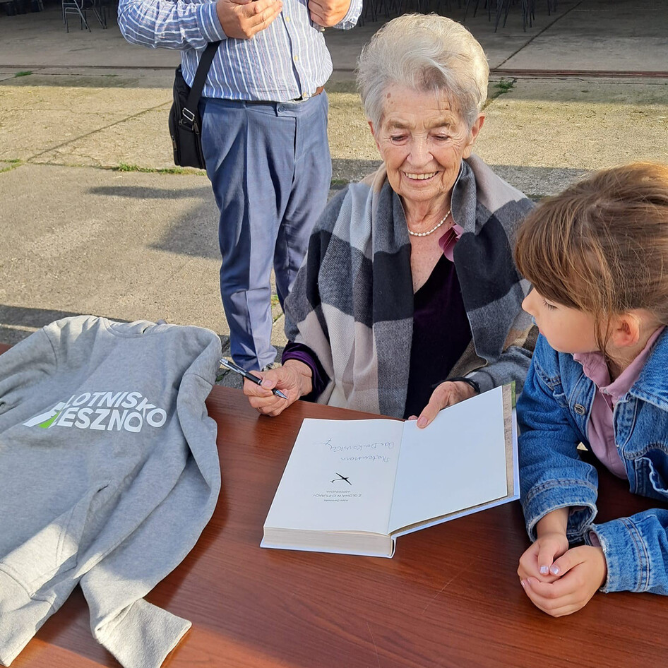 Glider pilot Adela Dankowska signing books at her celabration
